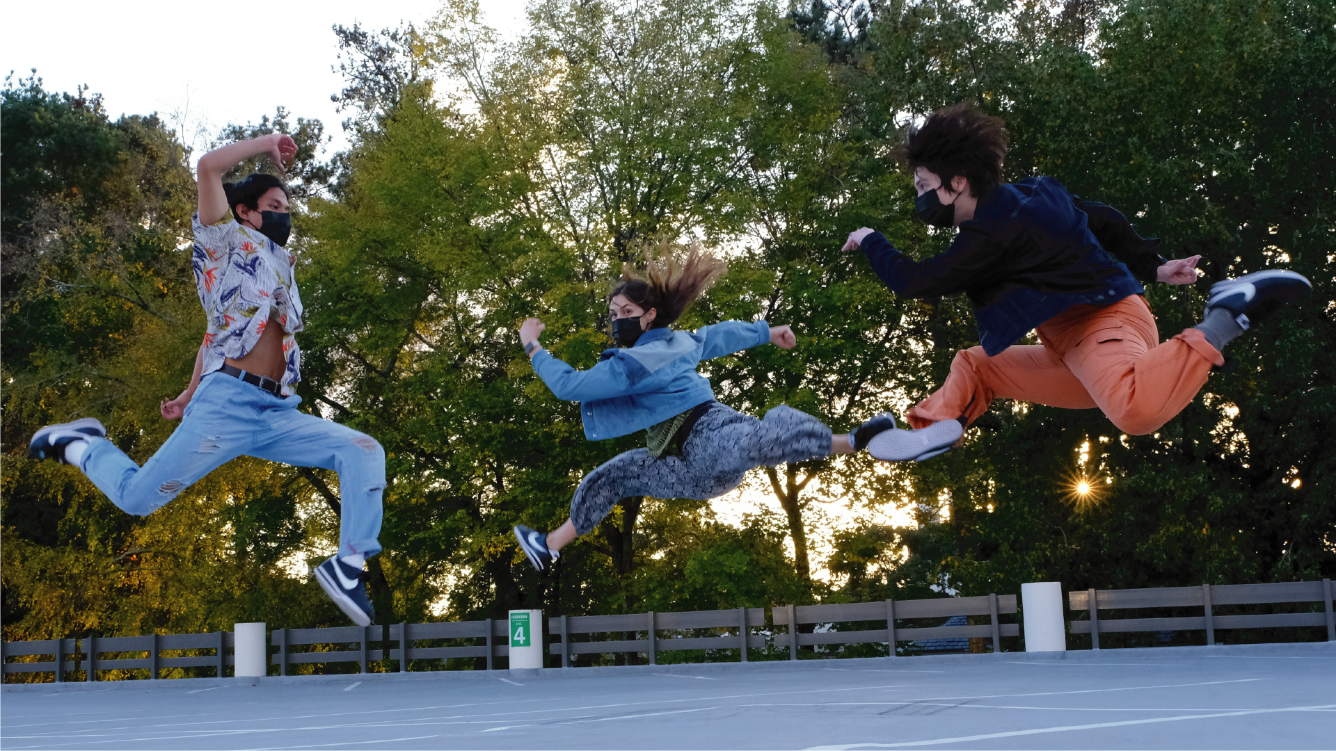 Student dancers jump in the air